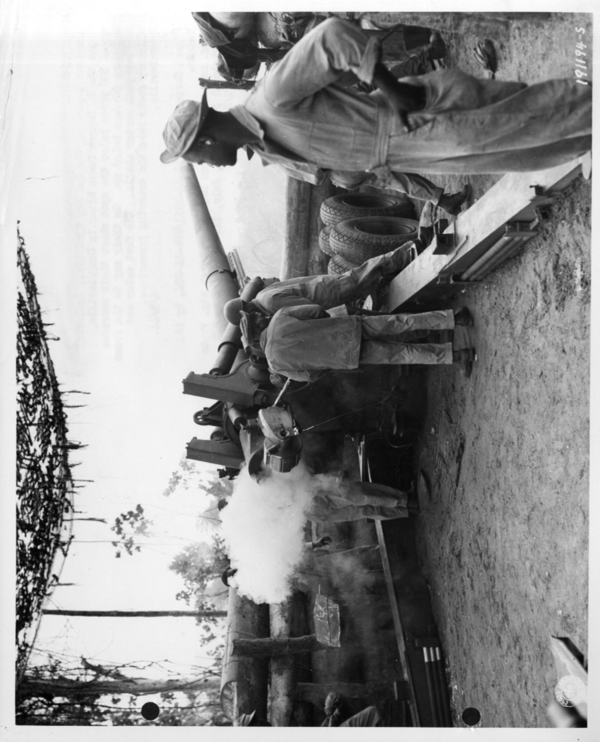 An image of Battery B, 49th Coast Artillery, section 2, fires at Japanese positions on Bougainville