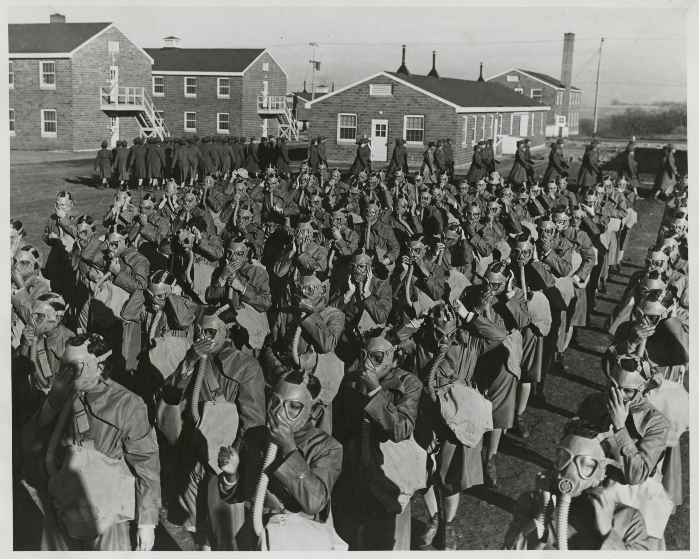 Historical image showing Black Americans of the Women's Army Auxiliary Corps receive gasmask training. of Black American soldiers during WWII