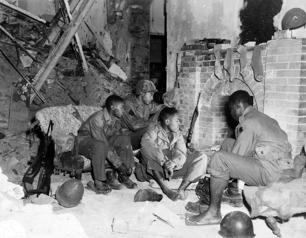 The United States army was segregated during World War II. This meant that Black Americans and white Americans served in seperate units. Source: National Archives and Records Administration (NAID: 364370).
